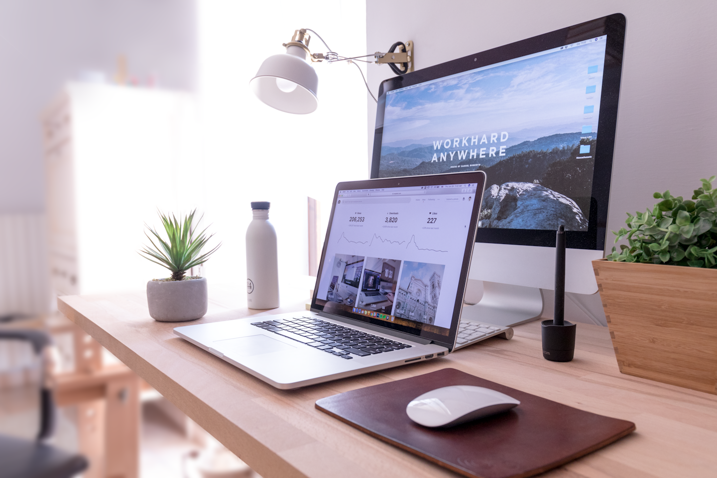 A laptop on a bright creative workspace